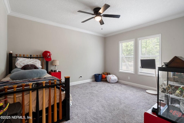 bedroom featuring crown molding, baseboards, and carpet