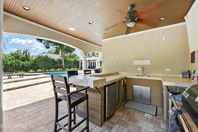 view of patio featuring area for grilling, an outdoor pool, and ceiling fan