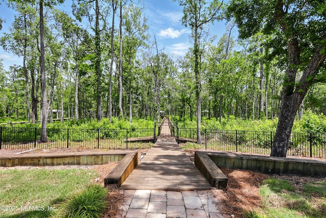 view of property's community with fence