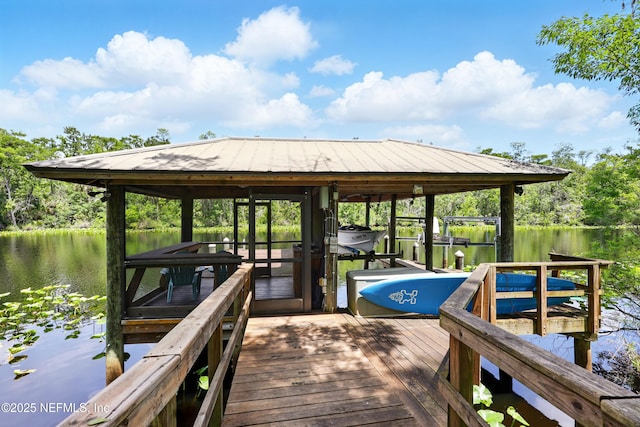 dock featuring boat lift and a water view