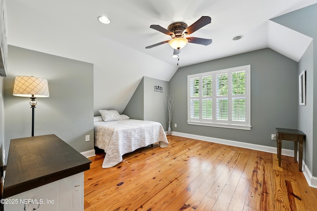 bedroom with lofted ceiling, light wood finished floors, baseboards, recessed lighting, and ceiling fan