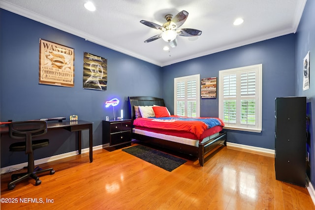 bedroom featuring wood finished floors, baseboards, recessed lighting, crown molding, and an office area