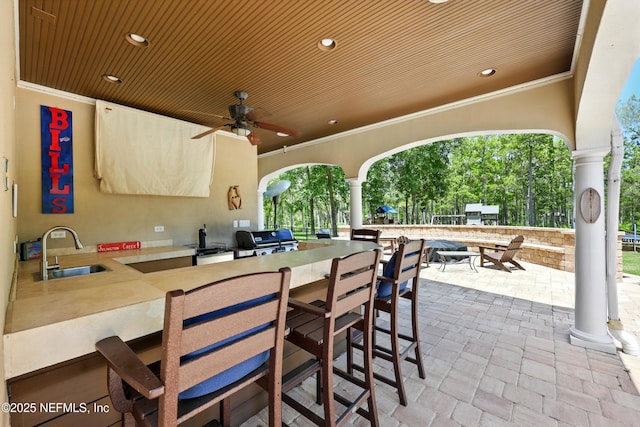 view of patio / terrace with area for grilling and ceiling fan