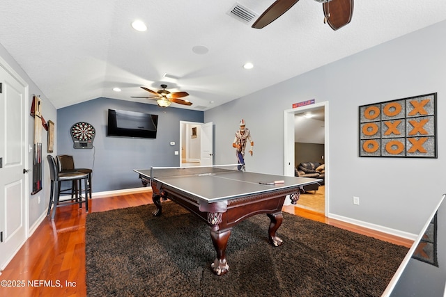 game room featuring ceiling fan, wood finished floors, recessed lighting, vaulted ceiling, and baseboards