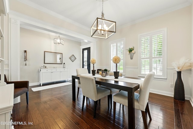 dining room featuring a chandelier, dark wood-style flooring, and crown molding