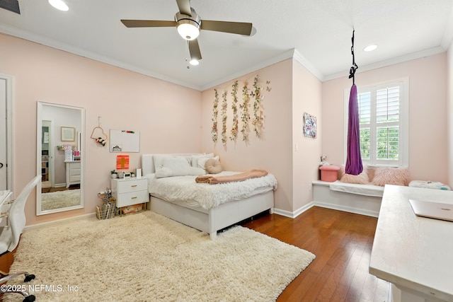 bedroom featuring ornamental molding, recessed lighting, dark wood-type flooring, baseboards, and ceiling fan