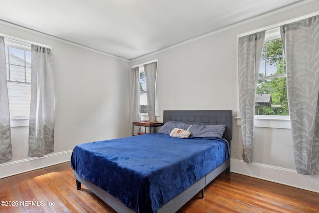 4949 Fremont St, Jacksonville, FL 32210 - bedroom with wood finished floors and multiple windows