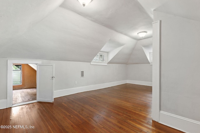 4949 Fremont St, Jacksonville, FL 32210 - bonus room featuring baseboards, lofted ceiling, and hardwood / wood-style flooring