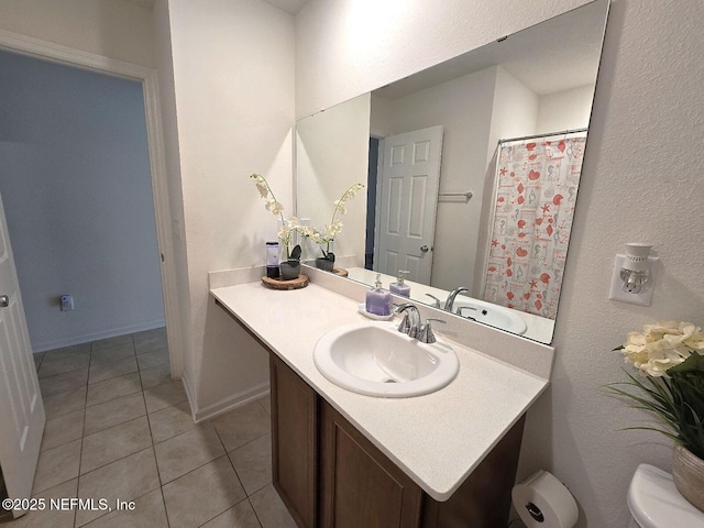 full bath featuring toilet, baseboards, tile patterned flooring, and vanity