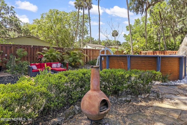 view of yard with an outdoor hangout area and a fenced backyard