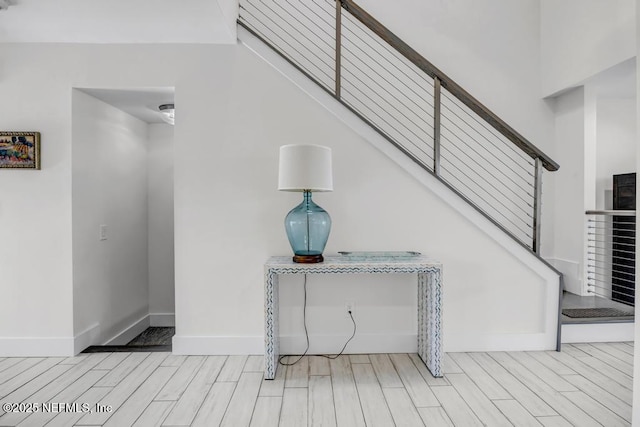 2325 Seminole Rd, Atlantic Beach, FL 32233 - entrance foyer with stairway, baseboards, and wood finish floors
