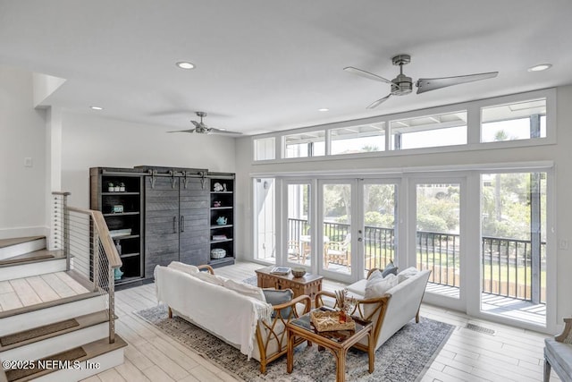 2325 Seminole Rd, Atlantic Beach, FL 32233 - living room with stairway, ceiling fan, light wood-type flooring, and recessed lighting