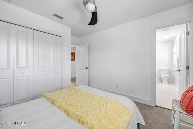 2325 Seminole Rd, Atlantic Beach, FL 32233 - carpeted bedroom featuring connected bathroom, baseboards, visible vents, and a closet