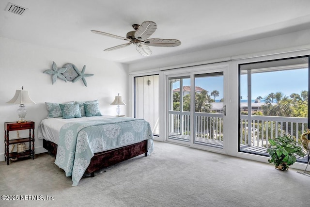 2325 Seminole Rd, Atlantic Beach, FL 32233 - carpeted bedroom featuring visible vents, access to exterior, and ceiling fan