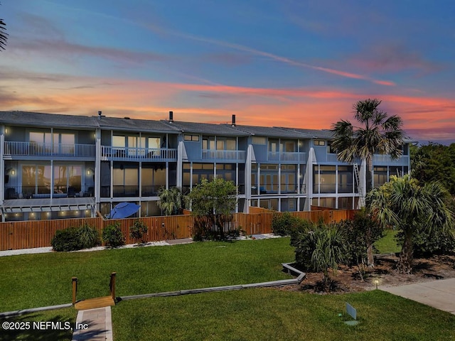 2325 Seminole Rd, Atlantic Beach, FL 32233 - rear view of house featuring a yard and a balcony
