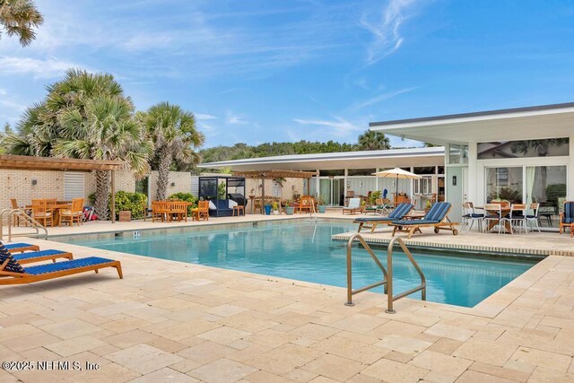 2325 Seminole Rd, Atlantic Beach, FL 32233 - community pool featuring outdoor dining area, a patio, and fence