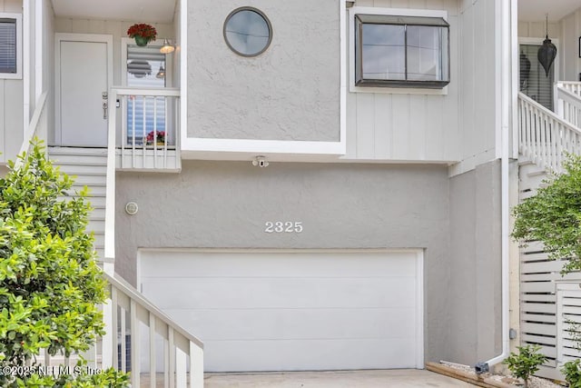 2325 Seminole Rd, Atlantic Beach, FL 32233 - exterior space with concrete driveway, an attached garage, and stucco siding