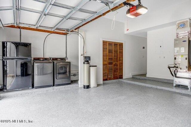 2325 Seminole Rd, Atlantic Beach, FL 32233 - garage featuring separate washer and dryer, freestanding refrigerator, and a garage door opener