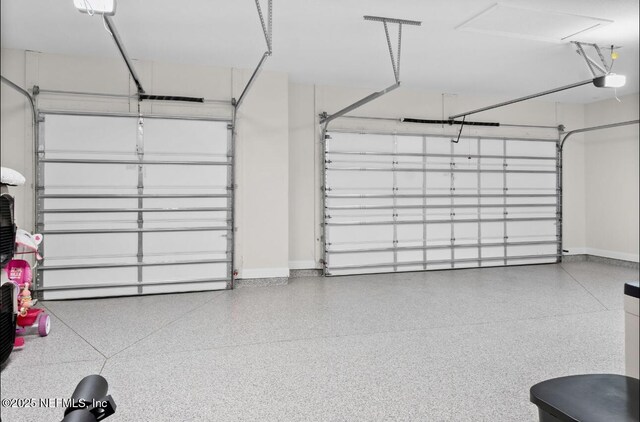 462 Hillendale Cir, Saint Johns, FL 32259 - garage featuring baseboards and a garage door opener