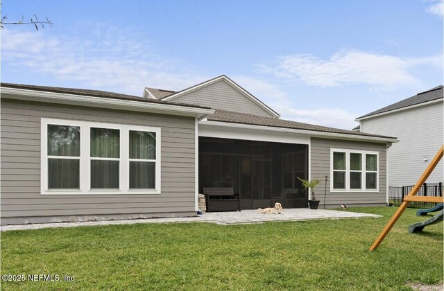 462 Hillendale Cir, Saint Johns, FL 32259 - back of house featuring a sunroom, a playground, a patio area, and a yard