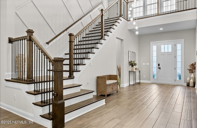 462 Hillendale Cir, Saint Johns, FL 32259 - entryway featuring stairway, baseboards, a high ceiling, and wood finished floors