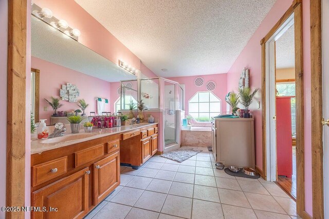 285 Village Green Ave, Saint Johns, FL 32259 - bathroom with a textured ceiling, a stall shower, tile patterned floors, vanity, and a bath