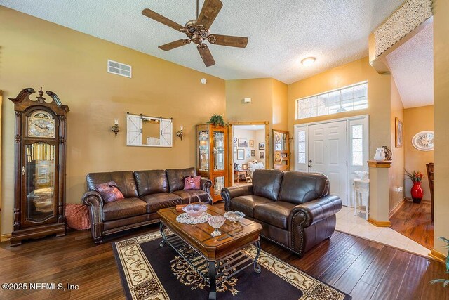 285 Village Green Ave, Saint Johns, FL 32259 - living room featuring a textured ceiling, high vaulted ceiling, a ceiling fan, hardwood / wood-style floors, and baseboards