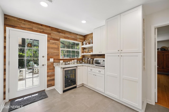 bar featuring recessed lighting, a toaster, wood walls, and beverage cooler