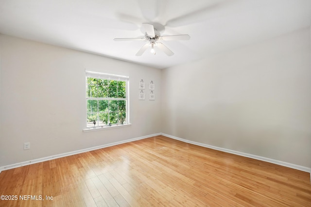 unfurnished room featuring baseboards, ceiling fan, and light wood finished floors