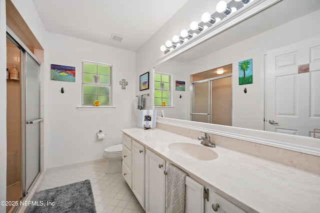 full bath featuring vanity, visible vents, toilet, tile patterned floors, and a stall shower
