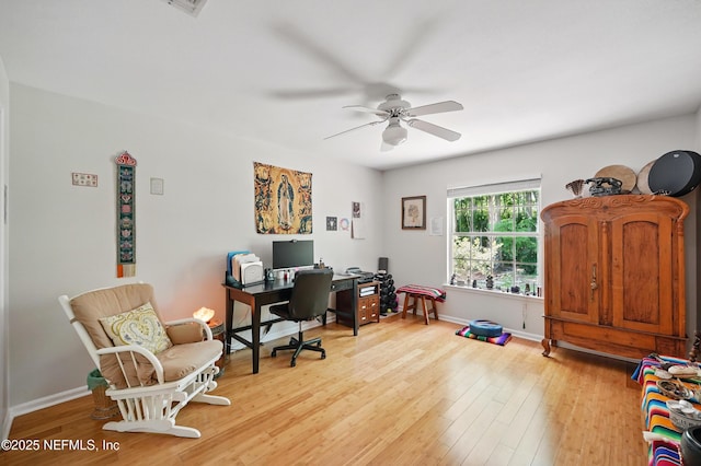 office area featuring baseboards, ceiling fan, and light wood-type flooring