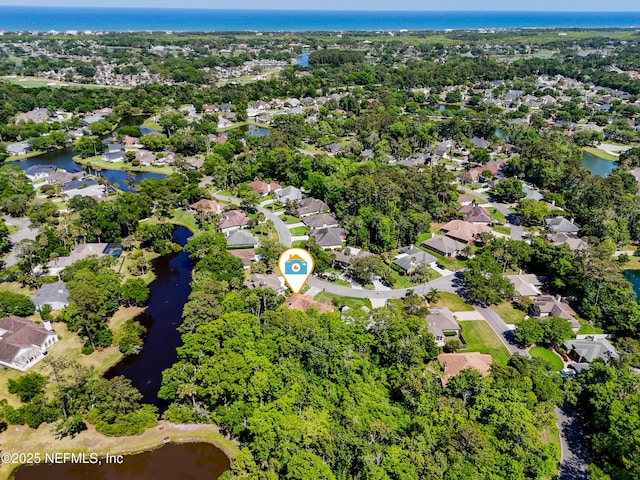 bird's eye view featuring a water view and a residential view