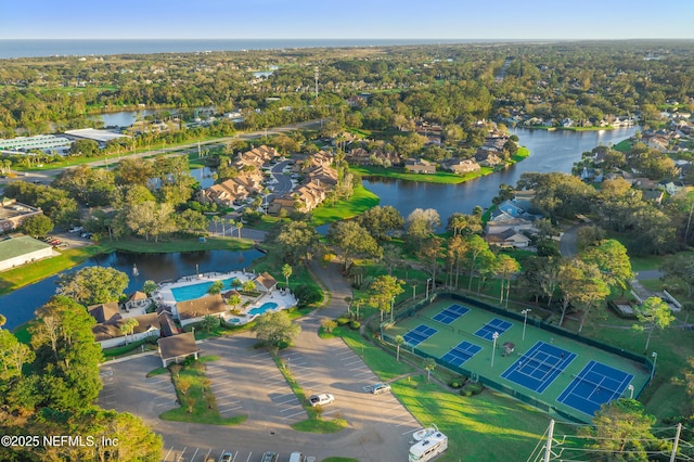 birds eye view of property with a residential view and a water view