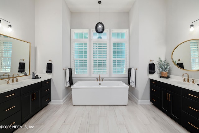 742 Honey Blossom Rd, Saint Johns, FL 32259 - bathroom featuring two vanities, a sink, and a wealth of natural light