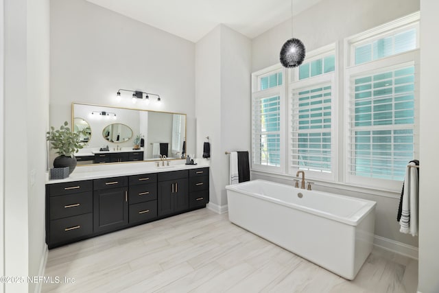 742 Honey Blossom Rd, Saint Johns, FL 32259 - full bath featuring a freestanding bath, vanity, and baseboards