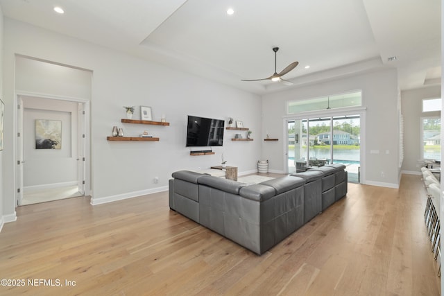 742 Honey Blossom Rd, Saint Johns, FL 32259 - living area featuring a raised ceiling, a ceiling fan, recessed lighting, and light wood finished floors
