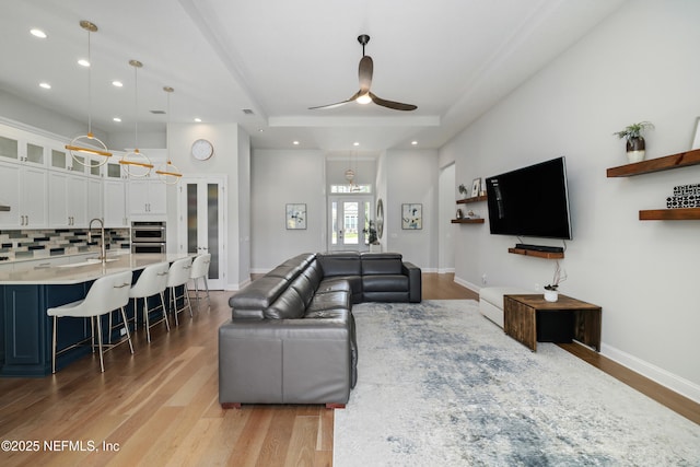 742 Honey Blossom Rd, Saint Johns, FL 32259 - living area featuring recessed lighting, light wood finished floors, ceiling fan, and a tray ceiling