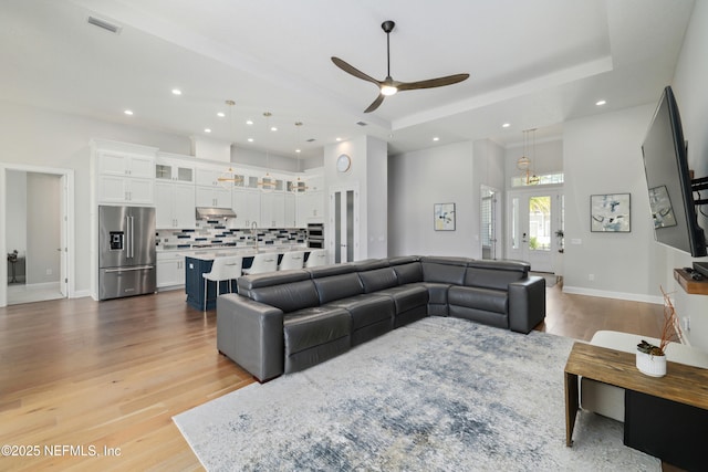 742 Honey Blossom Rd, Saint Johns, FL 32259 - living room with recessed lighting, a raised ceiling, ceiling fan, and light wood-type flooring