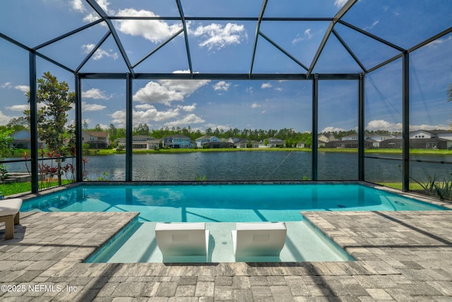742 Honey Blossom Rd, Saint Johns, FL 32259 - view of pool with glass enclosure, a water view, a pool with connected hot tub, and a residential view