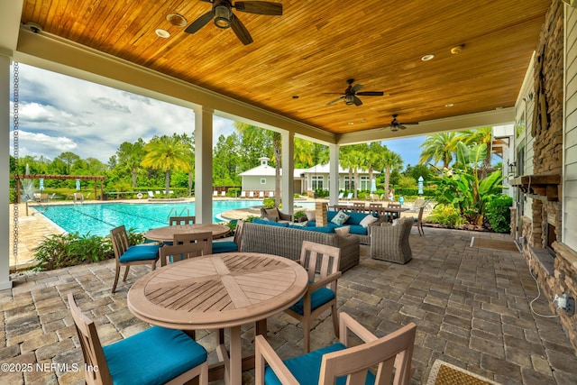 742 Honey Blossom Rd, Saint Johns, FL 32259 - view of patio featuring a community pool, an outdoor living space, a ceiling fan, and outdoor dining space