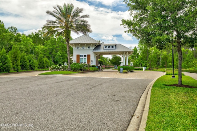 742 Honey Blossom Rd, Saint Johns, FL 32259 - view of front of home with driveway, a front yard, and metal roof
