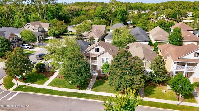 birds eye view of property with a residential view