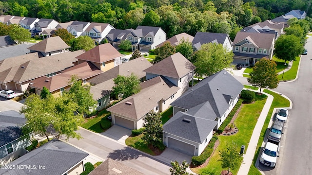 bird's eye view featuring a residential view and a view of trees