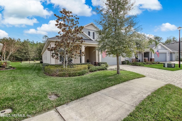 85325 Champlain Dr, Fernandina Beach, FL 32034 - view of front of home featuring decorative driveway and a front lawn