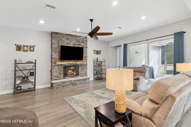 85325 Champlain Dr, Fernandina Beach, FL 32034 - living room with a ceiling fan, wood finished floors, recessed lighting, a fireplace, and baseboards