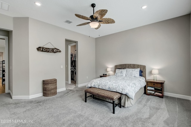 85325 Champlain Dr, Fernandina Beach, FL 32034 - carpeted bedroom featuring a spacious closet, baseboards, recessed lighting, ceiling fan, and a closet