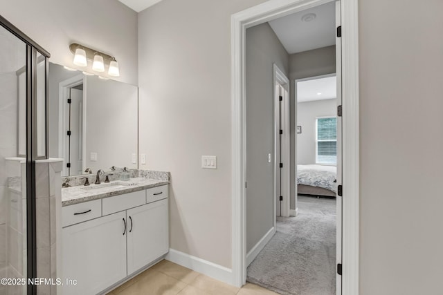 85325 Champlain Dr, Fernandina Beach, FL 32034 - ensuite bathroom with vanity, a shower stall, baseboards, and tile patterned floors