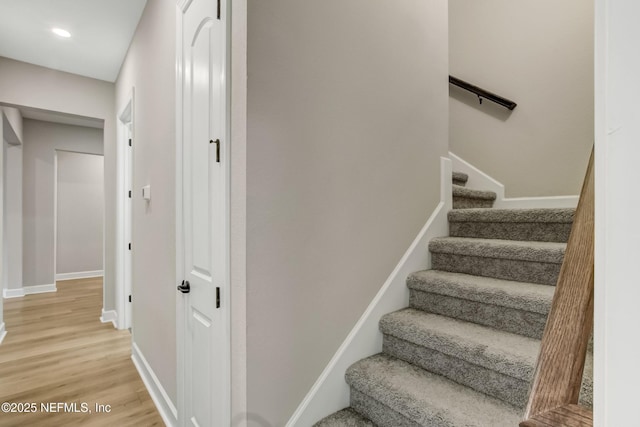85325 Champlain Dr, Fernandina Beach, FL 32034 - staircase featuring wood finished floors, baseboards, and recessed lighting