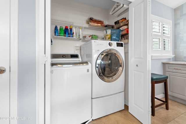 24 Fawn Gully Ln Unit E, Ponte Vedra, FL 32081 - laundry area featuring washing machine and clothes dryer and light tile patterned floors