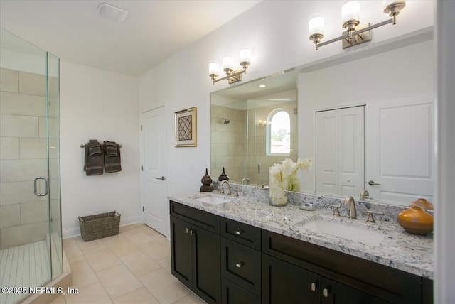 109 Rimini Ct, Jacksonville, FL 32225 - bathroom featuring a shower stall, tile patterned flooring, double vanity, and baseboards